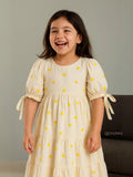 A girl in Yezwe Miniature Yellow Love Embroidered Kora Modest Maxi Dress For Junior Girls laughing 