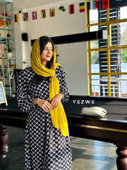 Yezwe belted classy maxi dress in black and white pattern, styled with a yellow scarf for a chic look