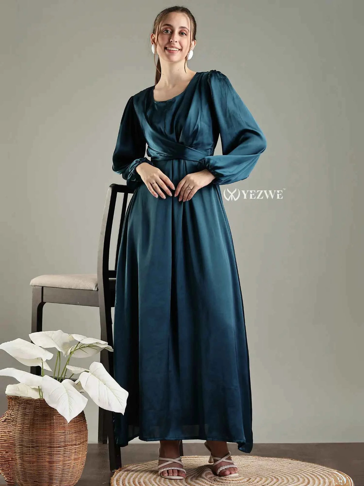 YEZWE blue satin flare modest gown featuring long sleeves and a flattering waistline