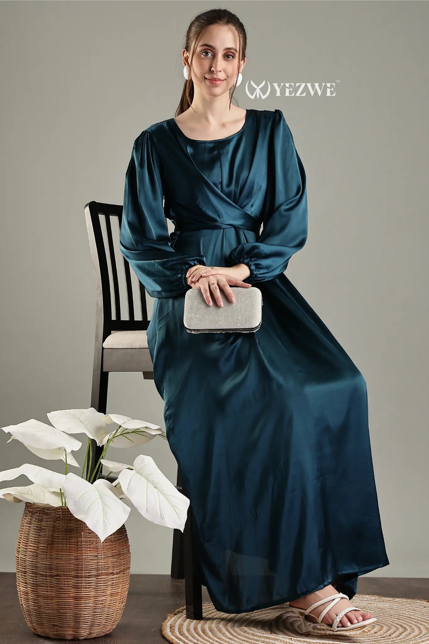 YEZWE blue satin flare modest gown featuring a stylish wrap design and long sleeves