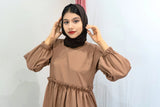 Woman wearing a Brown Co-ord Set Modest Wear with long puffed sleeves and a black hijab