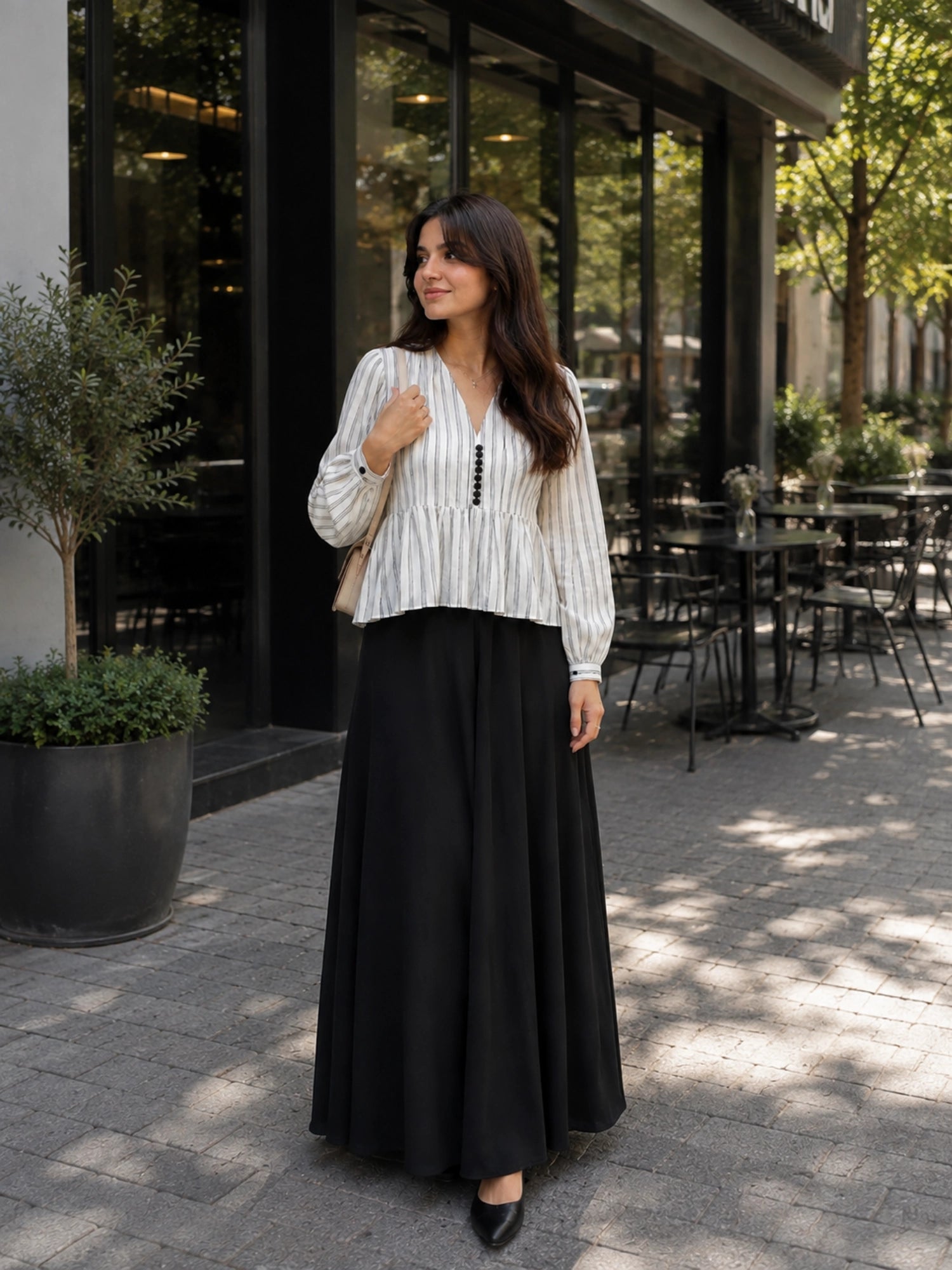 Classic Striped Peplum Top & Black Maxi Skirt Co-ord Set for Women styled outdoors in a cafe setting