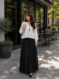 Classic Striped Peplum Top & Black Maxi Skirt Co-ord Set for Women styled outdoors in a cafe setting