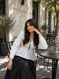 Classic Striped Peplum Top & Black Maxi Skirt Co-ord Set for Women featuring a stylish café setting