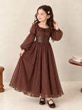 Chocolate brown girls maxi dress with sheer bishop sleeves and puff shoulders