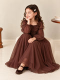 Ruffled neckline and lace-up faux-leather corset waist close-up