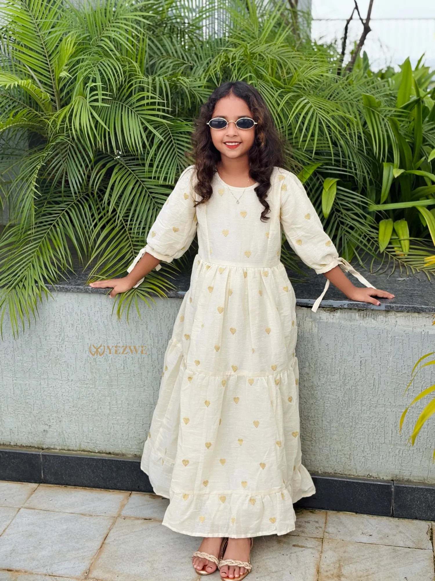 Junior Girls Gown by YEZWE in cream with gold heart patterns and puff sleeves