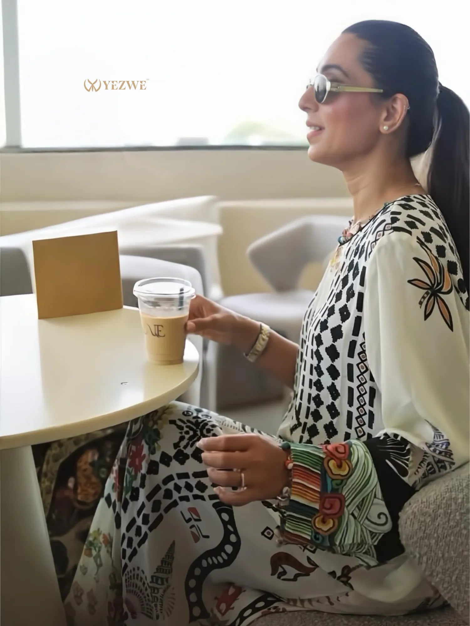 Stylish YEZWE Jalabiya Maxi Dress in a vibrant floral print, perfect for casual or formal occasions.