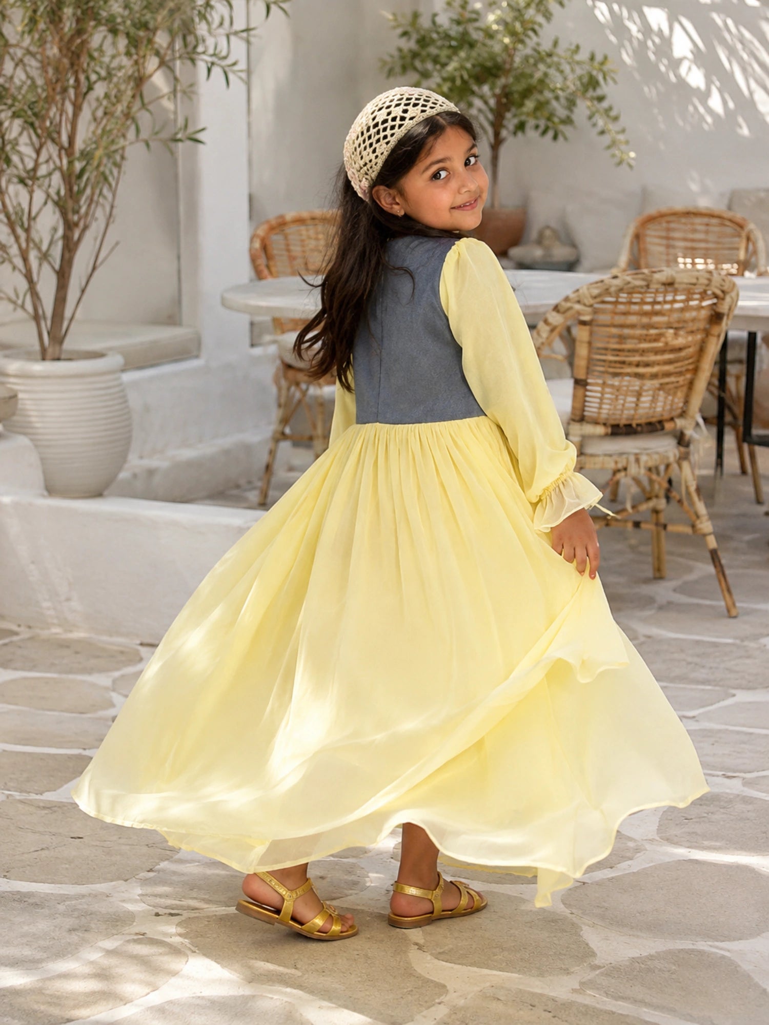 Junior Girls Pastel Yellow Corset Maxi Dress with Denim Bodice in a bright outdoor setting