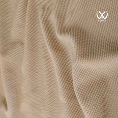 Close-up of soft fabric texture of Yezwe knitted Modest maxi dress for women in beige color