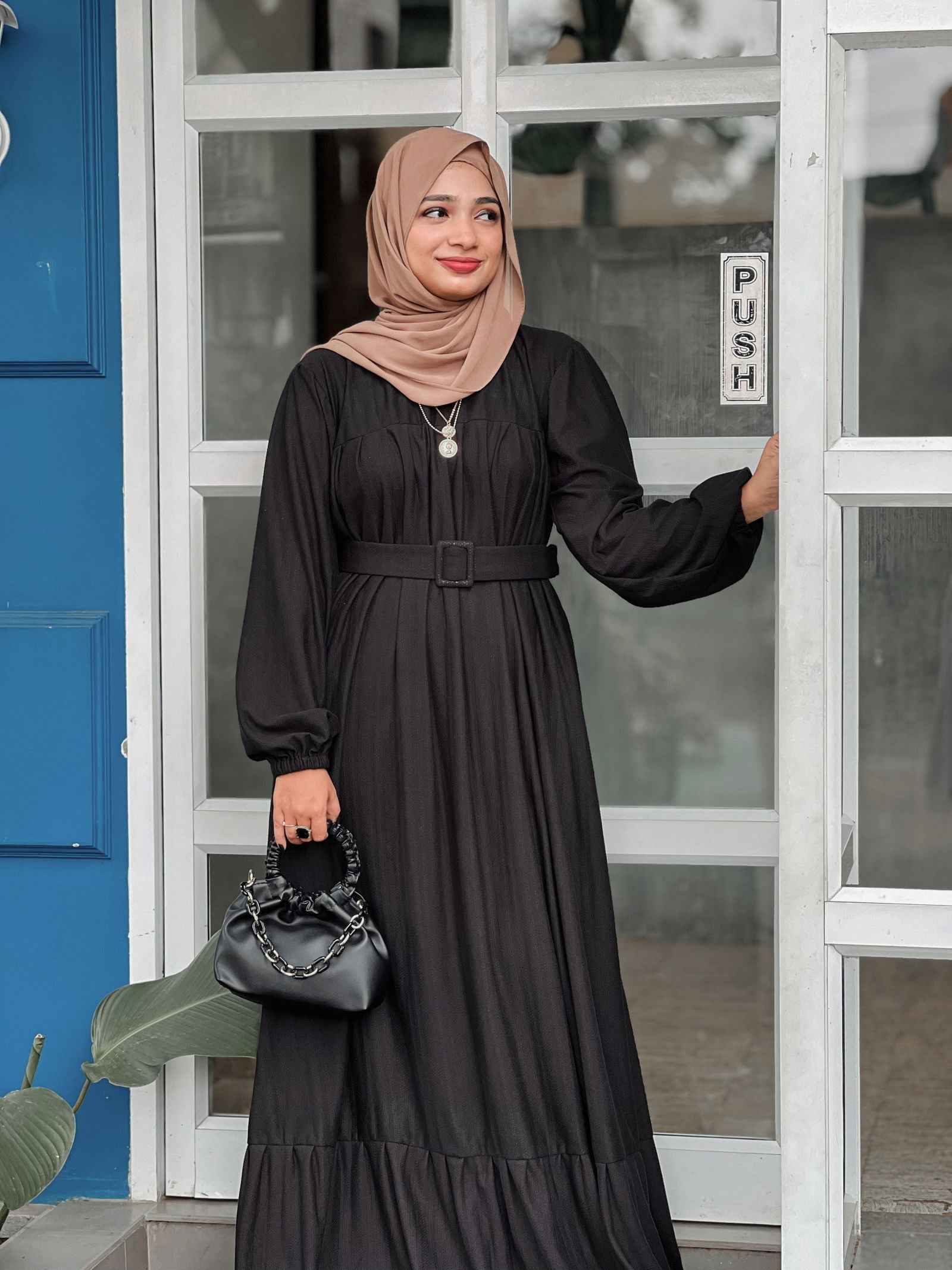 Modest black maxi dress by Yezwe featuring long sleeves and a belted waist for a classic look