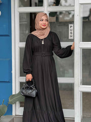 Modest black maxi dress by Yezwe featuring long sleeves and a belted waist for a classic look