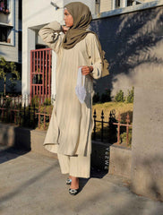 Yezwe modest co-ord set in beige with a long top and matching pants, styled elegantly outdoors