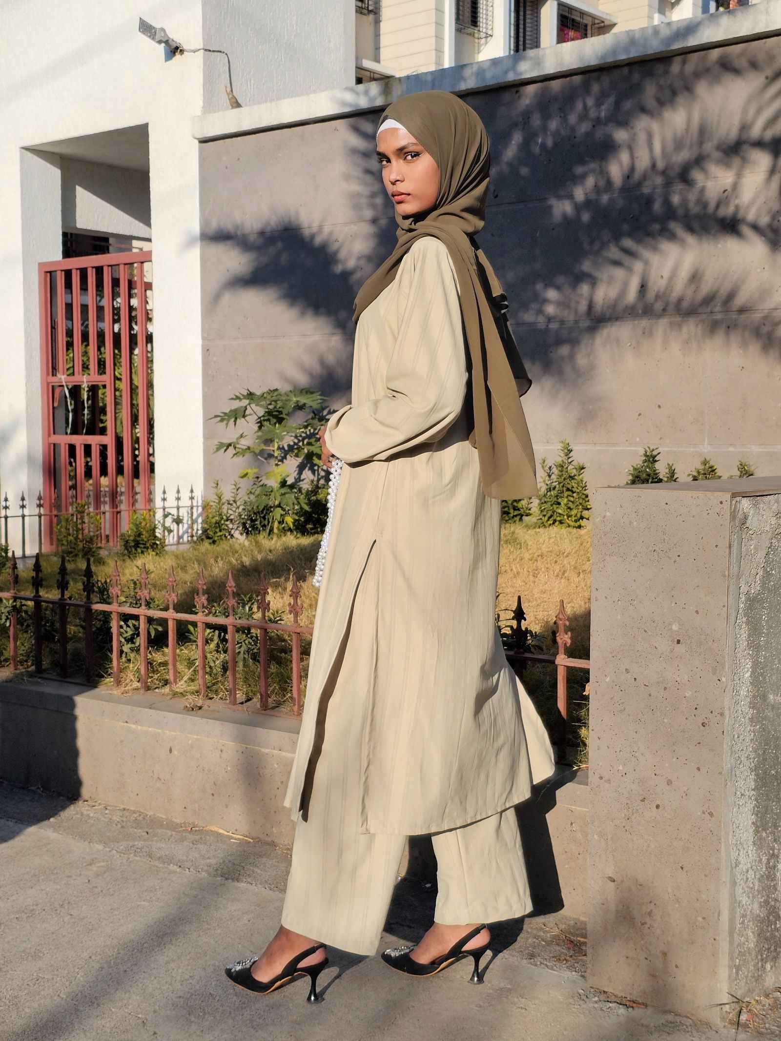 Elegant Yezwe modest co-ord set featuring a long tunic and wide-leg pants in a soft beige color