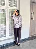 Yezwe modest fashion two-piece outfit featuring a patterned top and black pants for stylish comfort