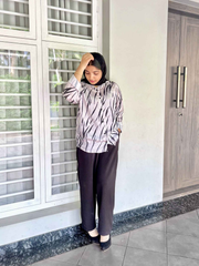 Yezwe modest fashion two-piece outfit featuring a patterned top and black pants for stylish comfort