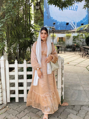 Modest golden beige maxi dress by Yezwe with long sleeves and tiered ruffle hem