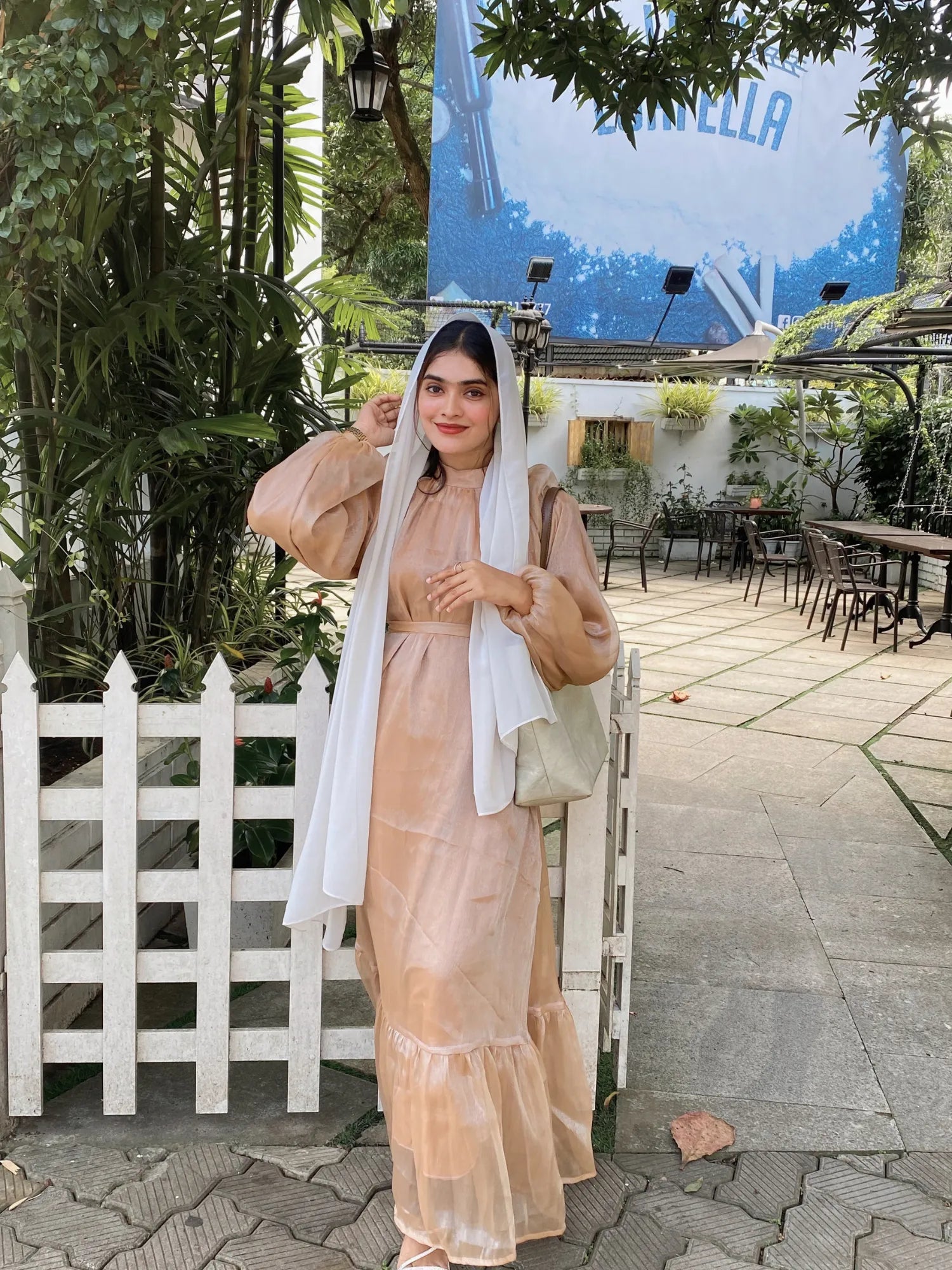 Yezwe modest golden beige maxi dress with long sleeves and ruffled hem, perfect for elegant occasions