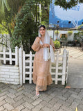 Modest golden beige maxi dress by Yezwe with layered ruffles and long sleeves, perfect for elegant occasions