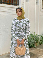 Modest green leaf maxi dress by Yezwe featuring a button-up design and long sleeves