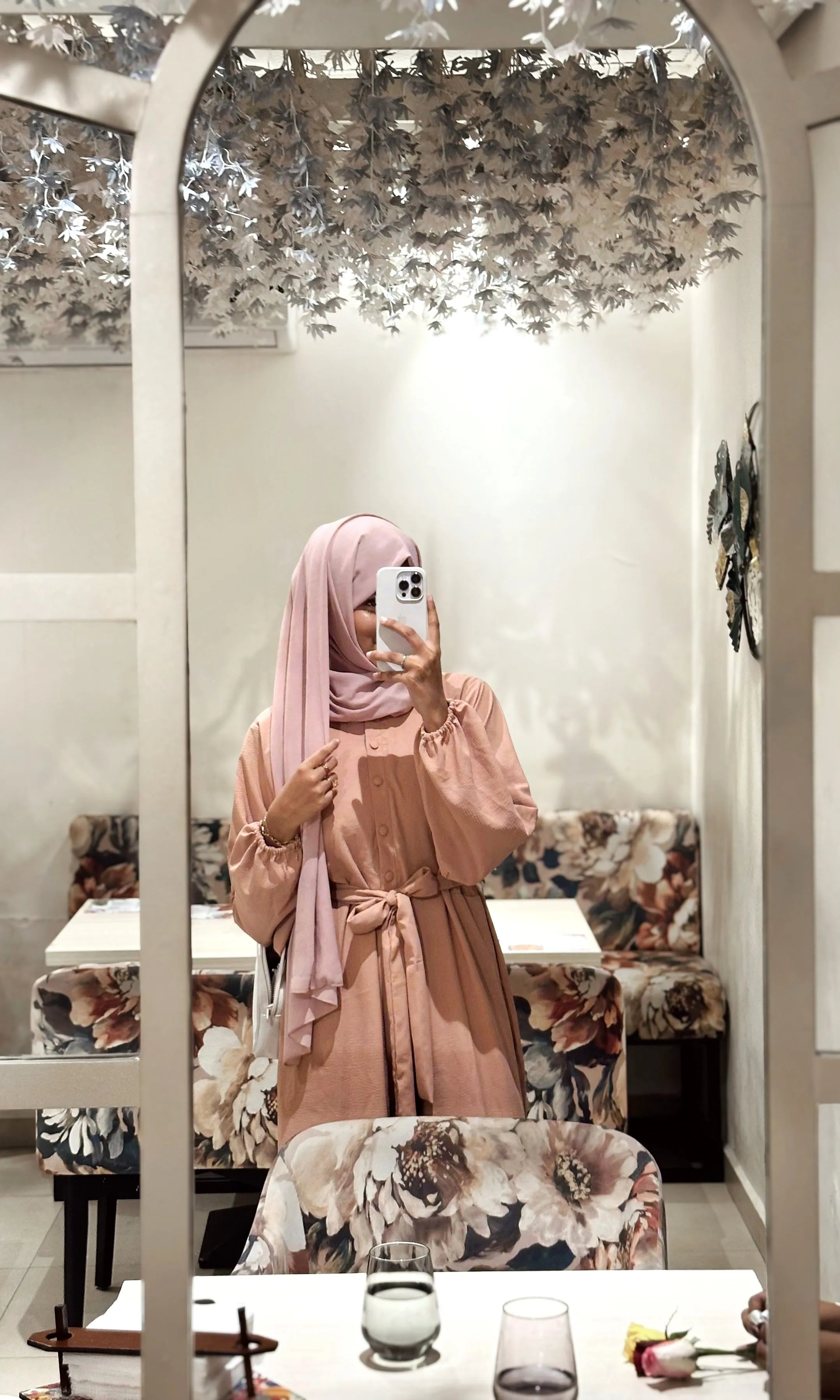 Yezwe modest jumpsuit with belt in soft pink, styled for elegant occasions and everyday wear