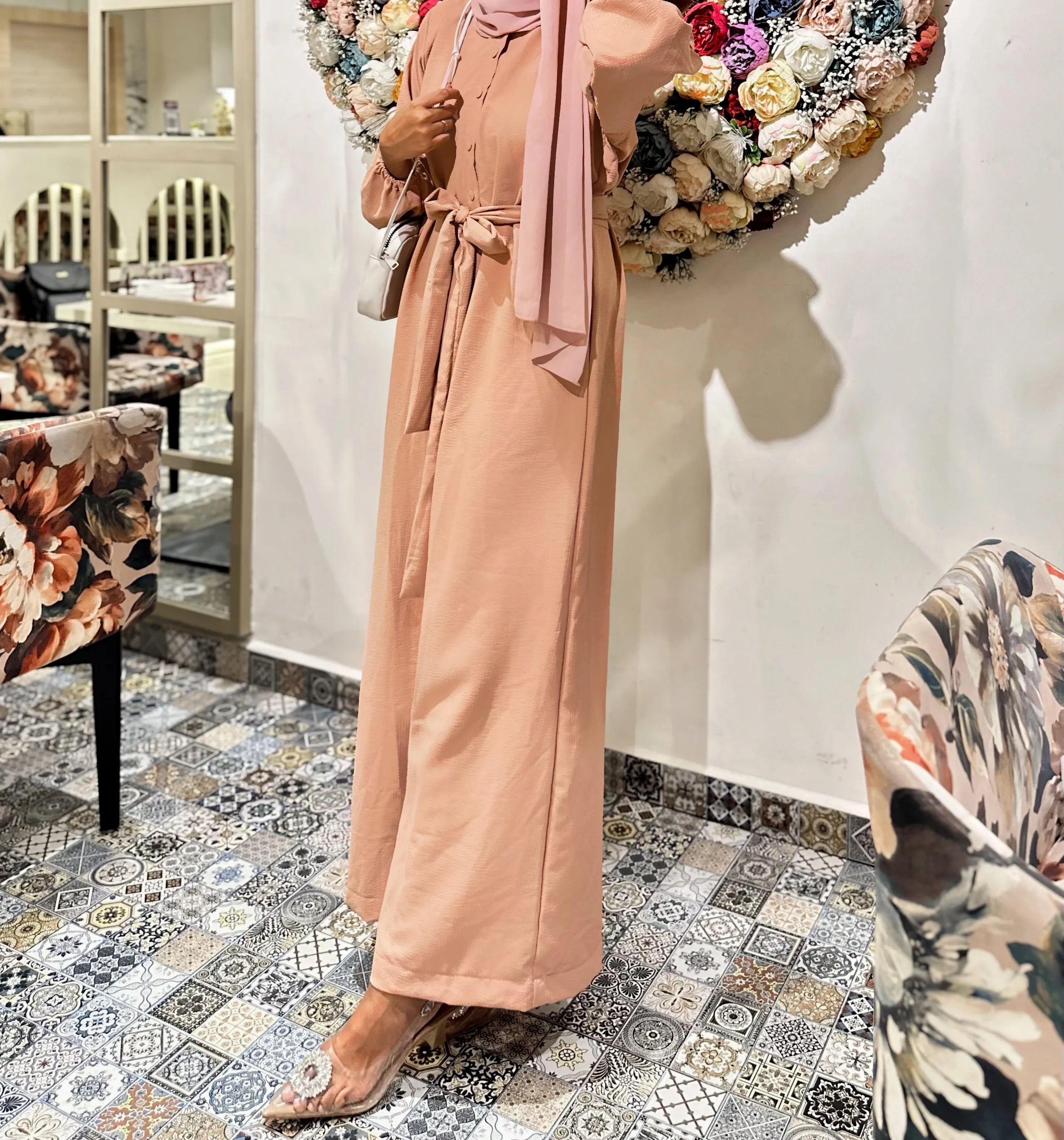 Yezwe modest jumpsuit with belt in soft pink, featuring long sleeves and a stylish silhouette