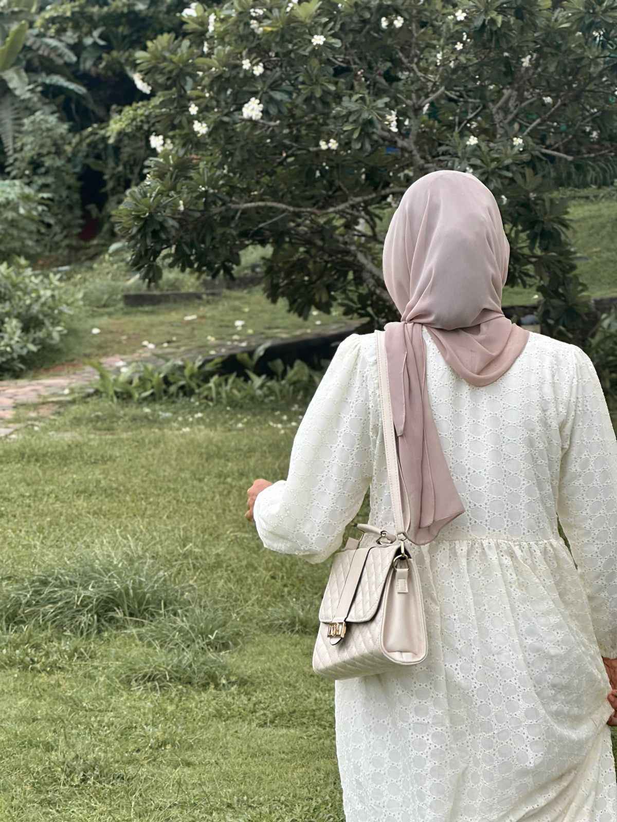 Modest off white maxi dress by Yezwe with elegant design, perfect for casual outings