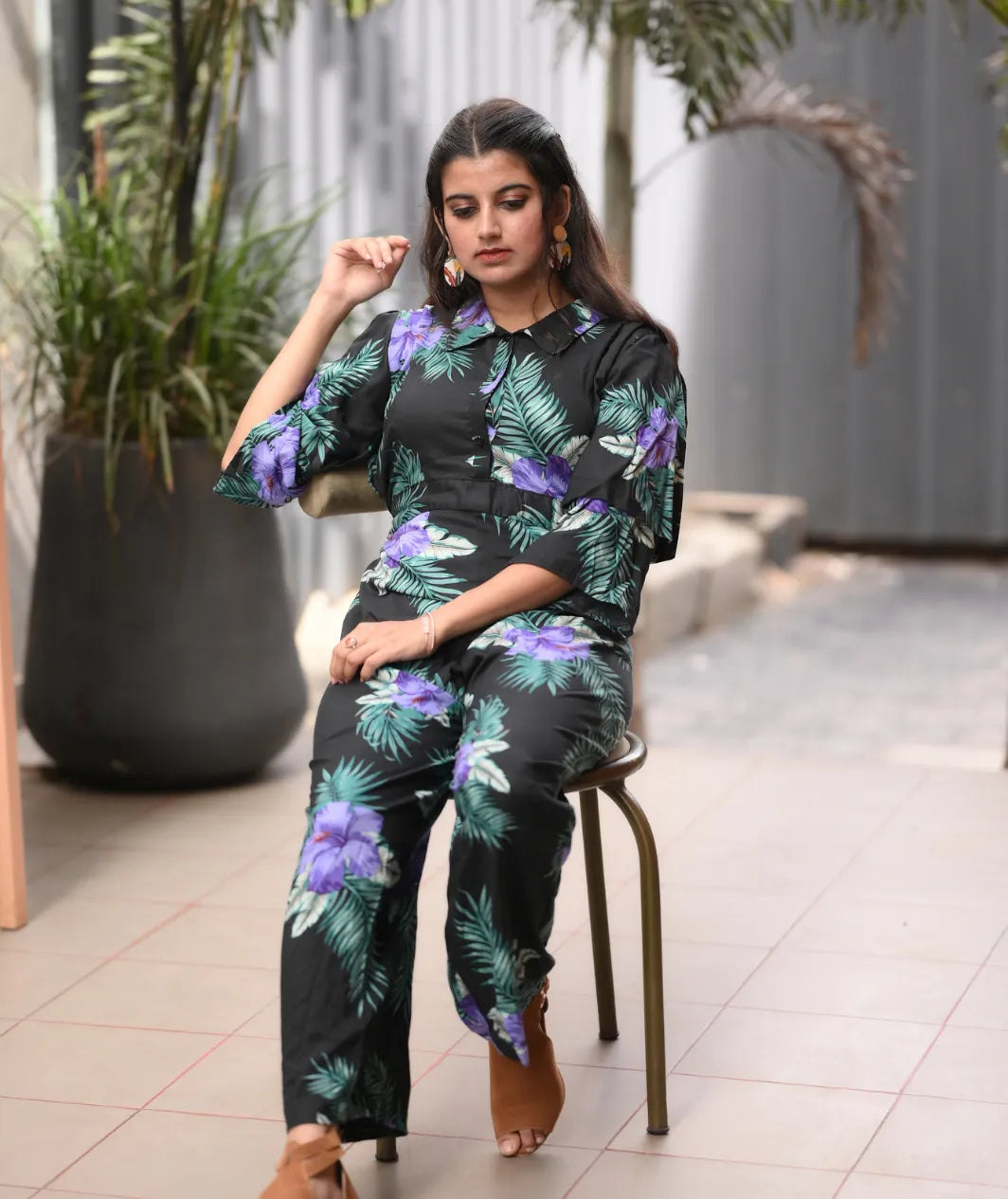 Yezwe modest wear jumpsuit in black with vibrant floral print, perfect for stylish comfort