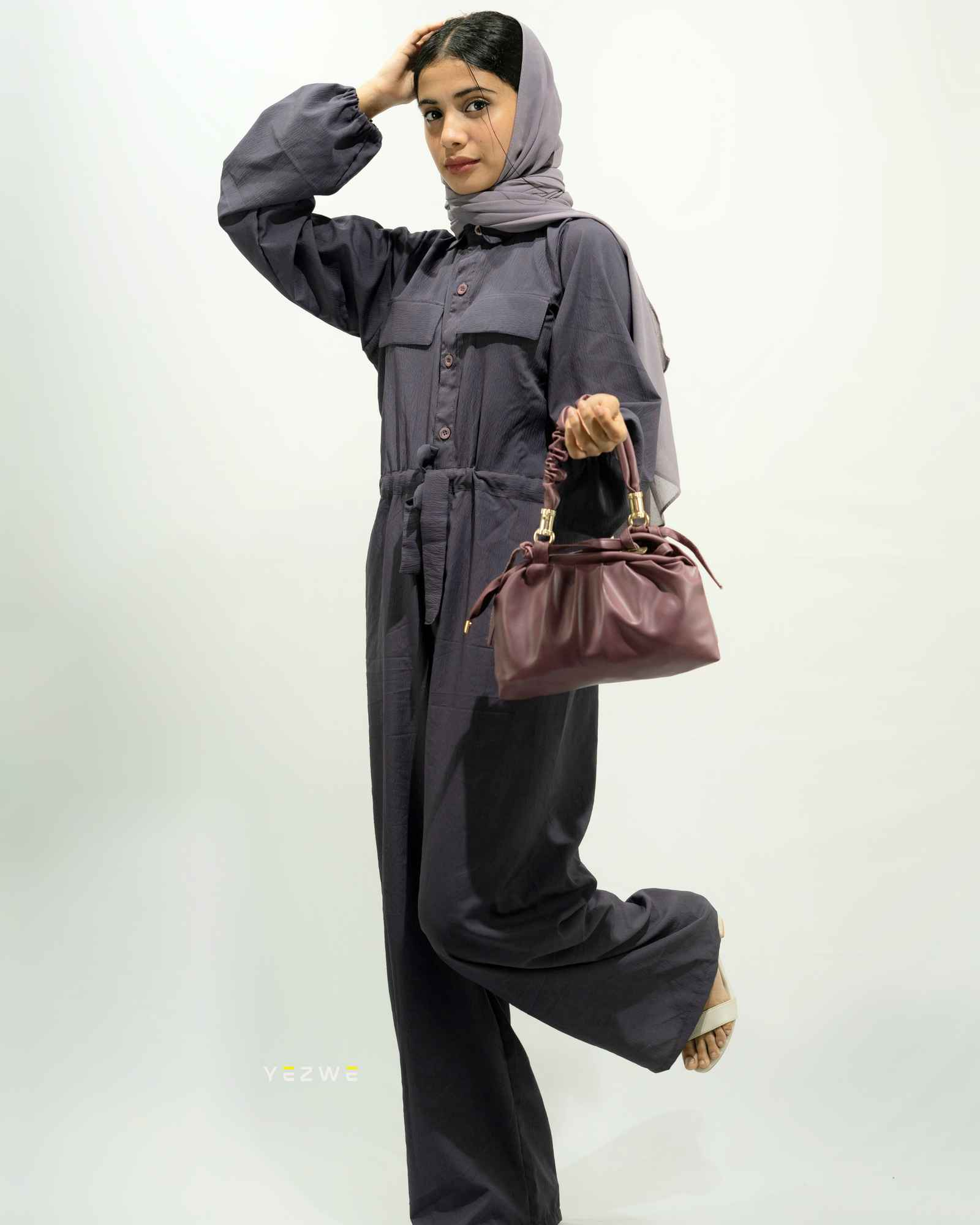 Yezwe modest wear jumpsuit women in dark gray with a stylish silhouette and elegant accessories