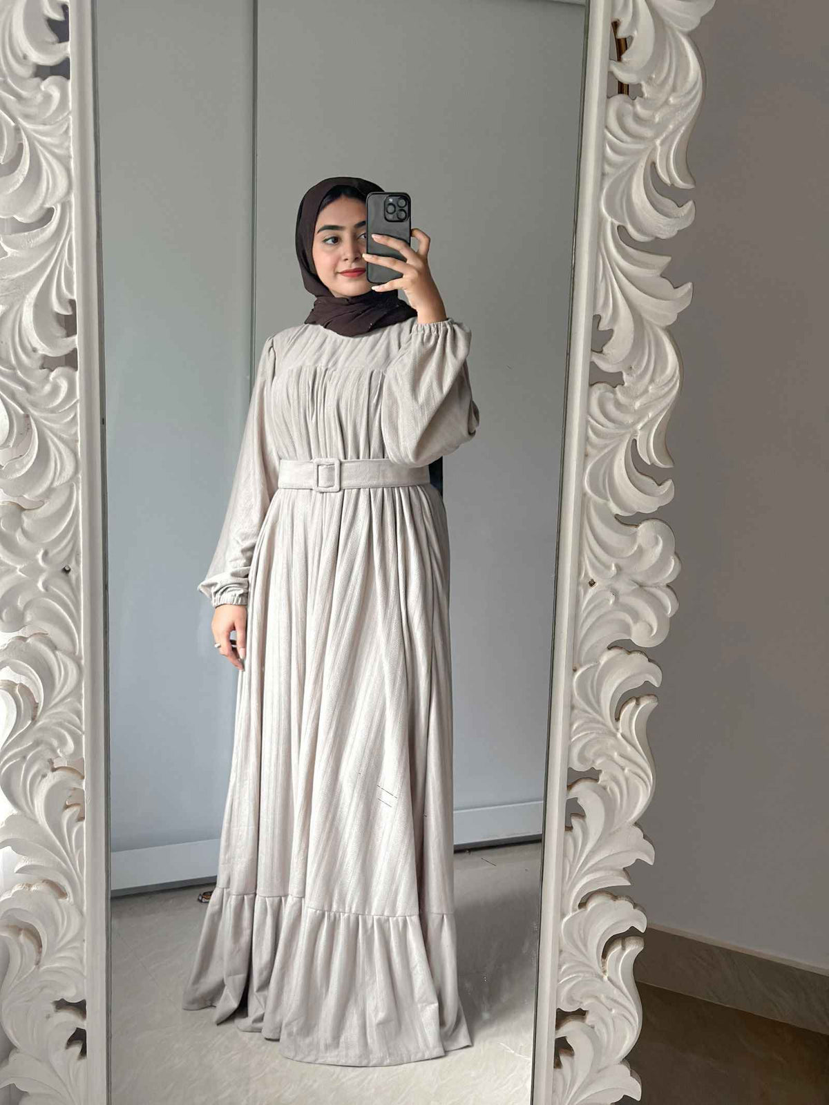 Yezwe modest wear maxi dress in soft gray with a belted waist and ruffled hem, perfect for stylish occasions