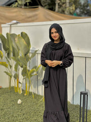 Yezwe modest wear maxi dress in black with long sleeves and a flowy hem for elegant style