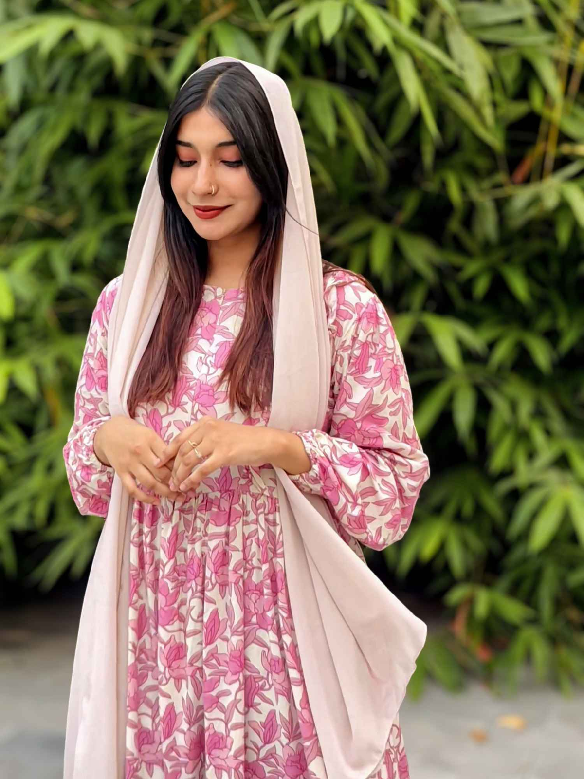 Yezwe modest wear maxi dress in pink floral print, complemented by a light scarf for an elegant look
