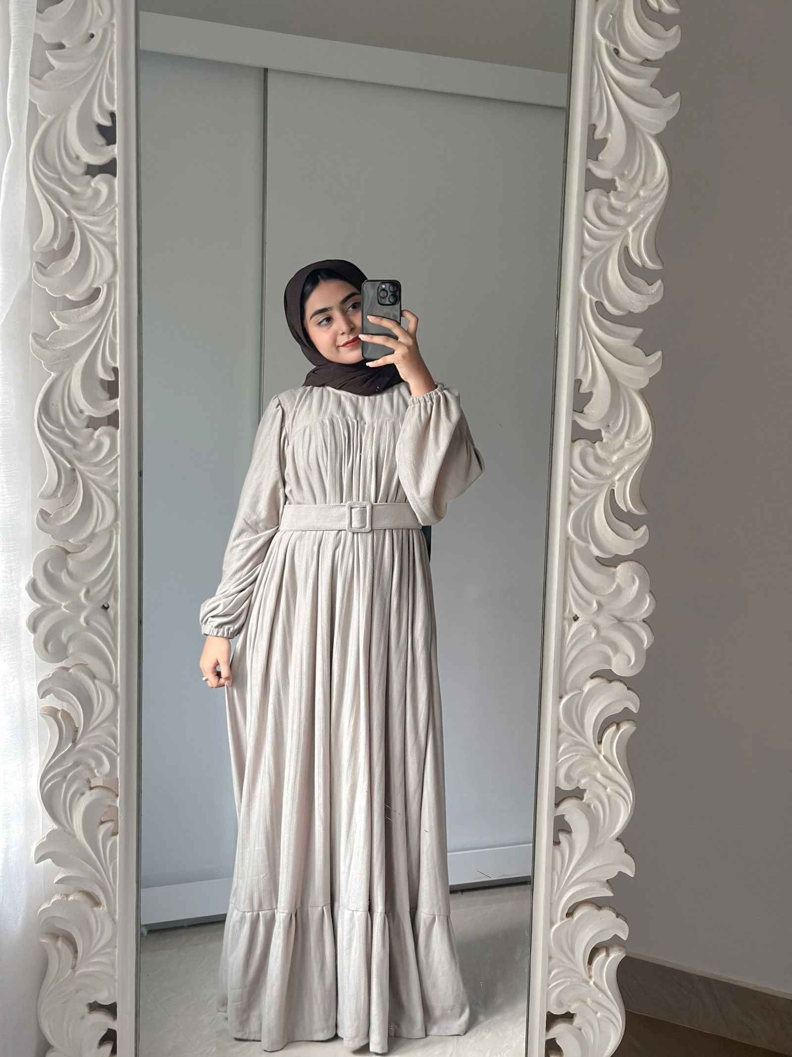 Yezwe modest wear maxi dress in light gray with a cinched waist and flowing skirt