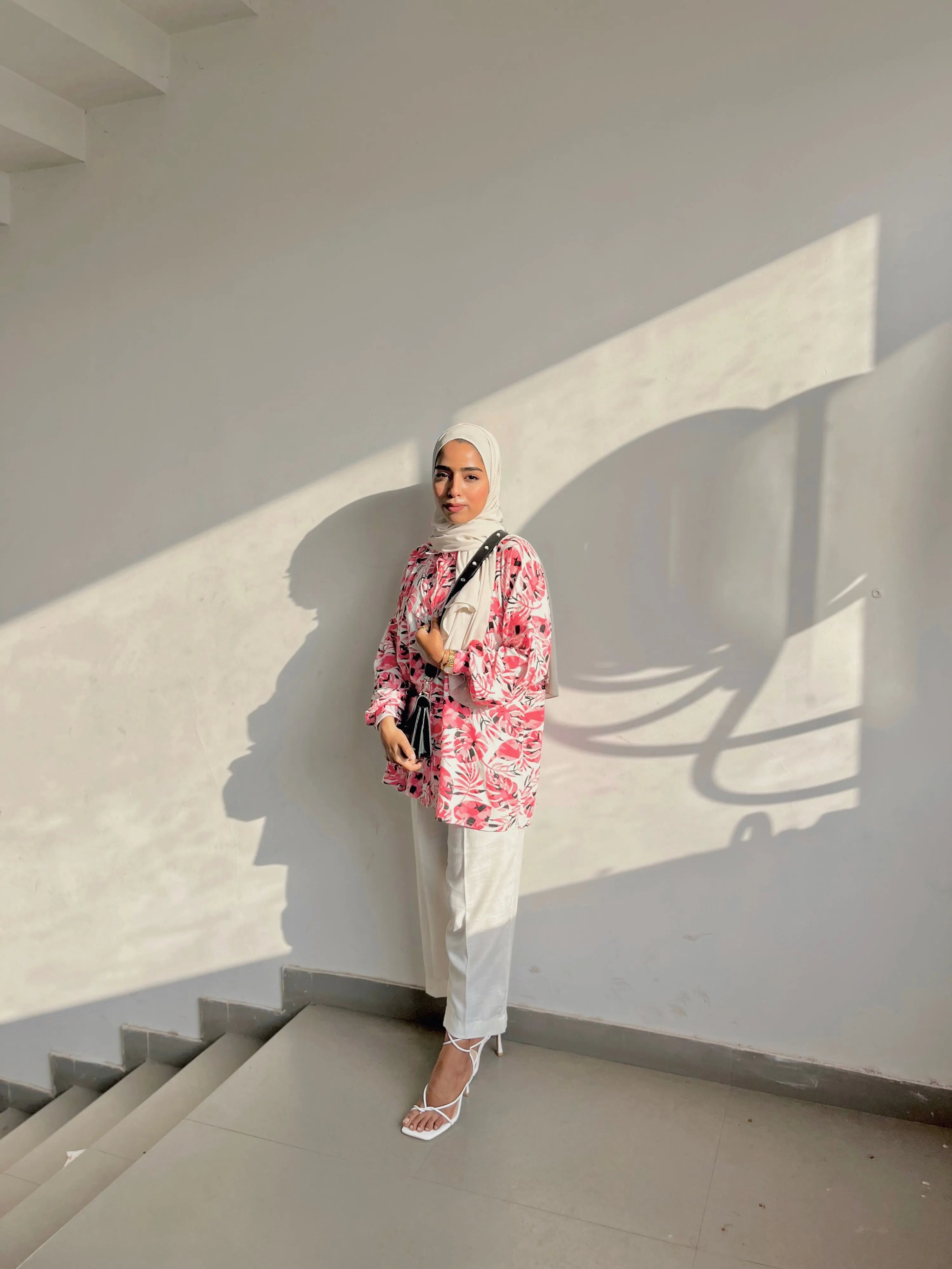 Modest wear pink printed shirt paired with white pants, showcasing a stylish and elegant look