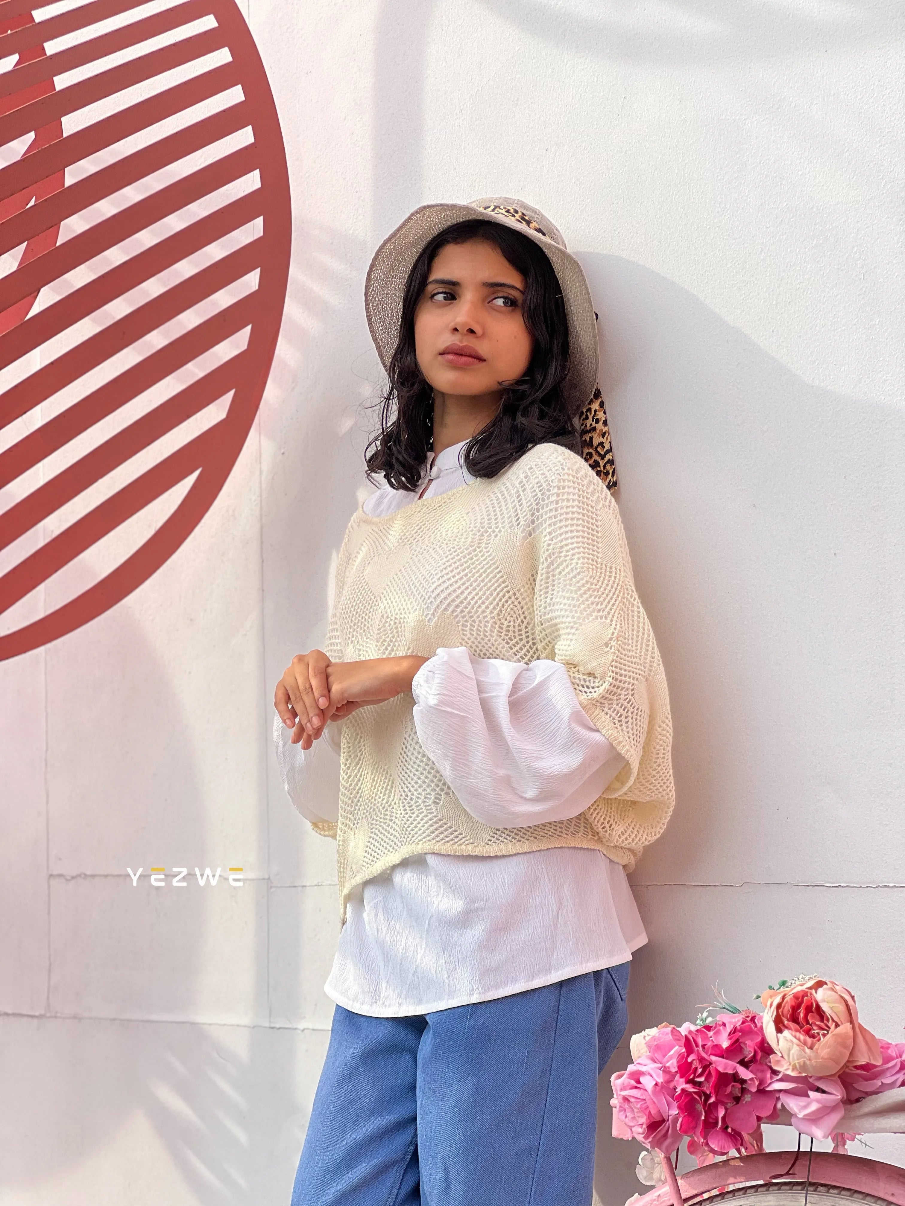 Yezwe modest women's shrug in cream, styled over a white shirt for a chic and casual look