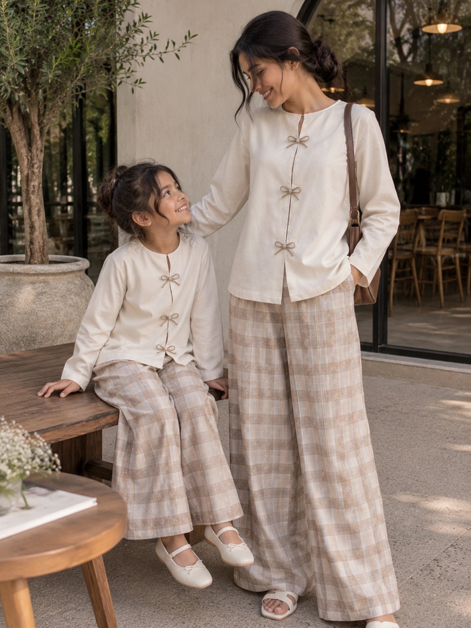 Mom and daughter matching co ord set featuring stylish beige tops and checkered wide-leg pants