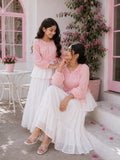 Mom and daughter matching maxi dress set in pink and white, featuring ruffled layers and a stylish design