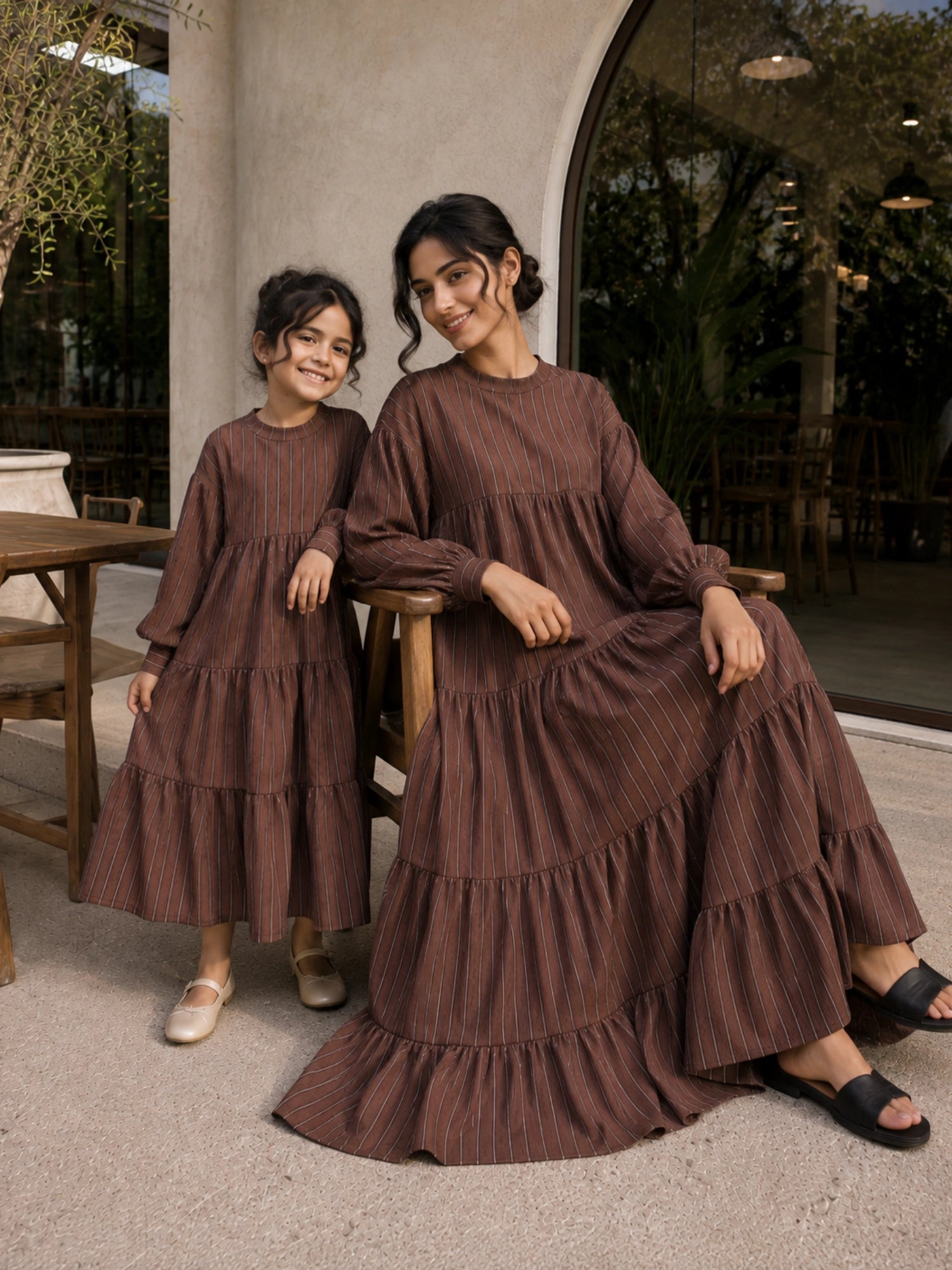 Mom and daughter matching tiered maxi dress set in brown with long sleeves and ruffled layers