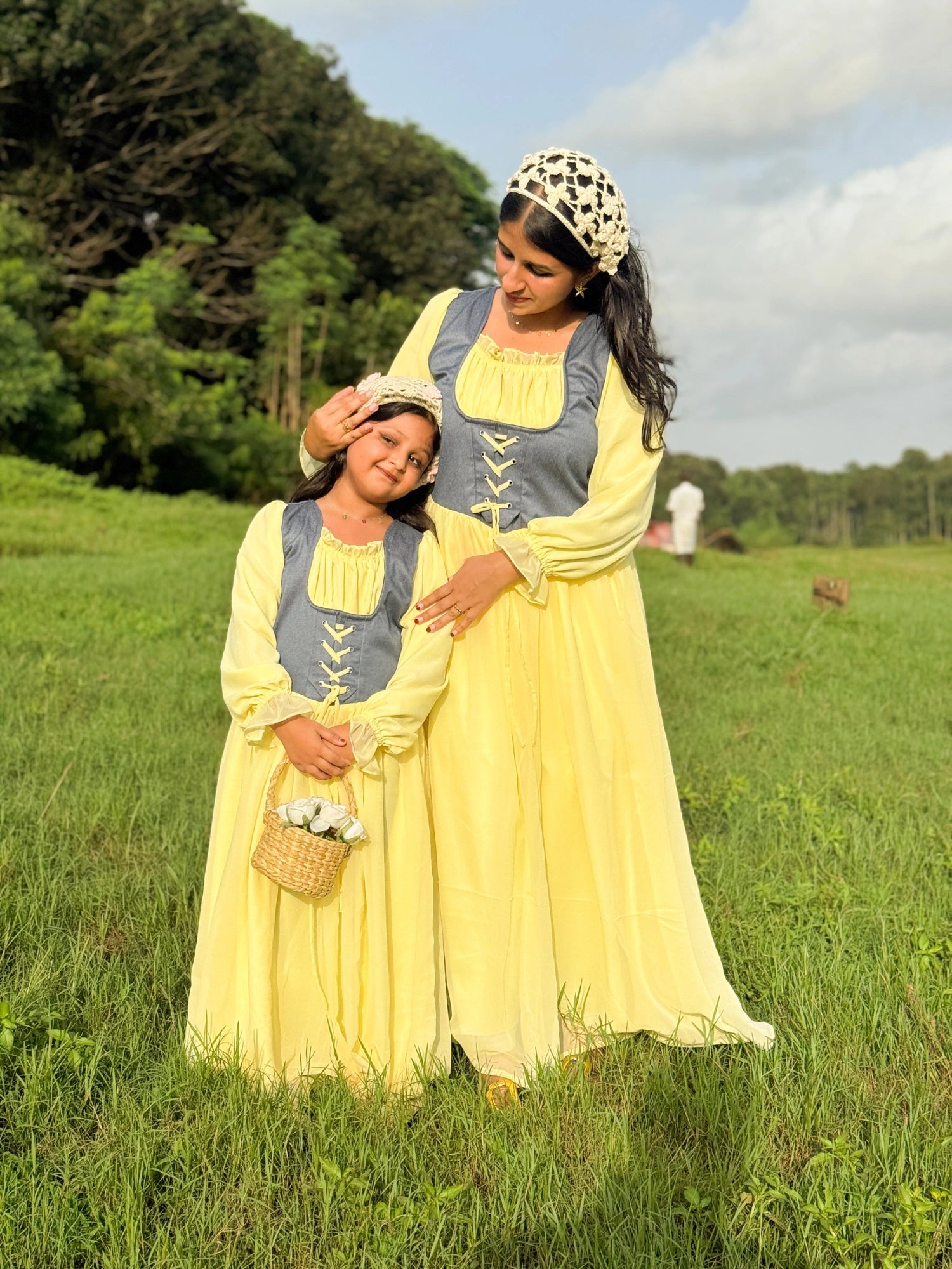 Mom & Daughter Matching Pastel Yellow Corset Maxi Dress Set with Denim Bodice in a sunny outdoor setting
