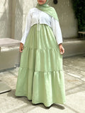 Pastel Green Modest Maxi Dress with long sleeves and tiered design, perfect for comfortable, stylish wear
