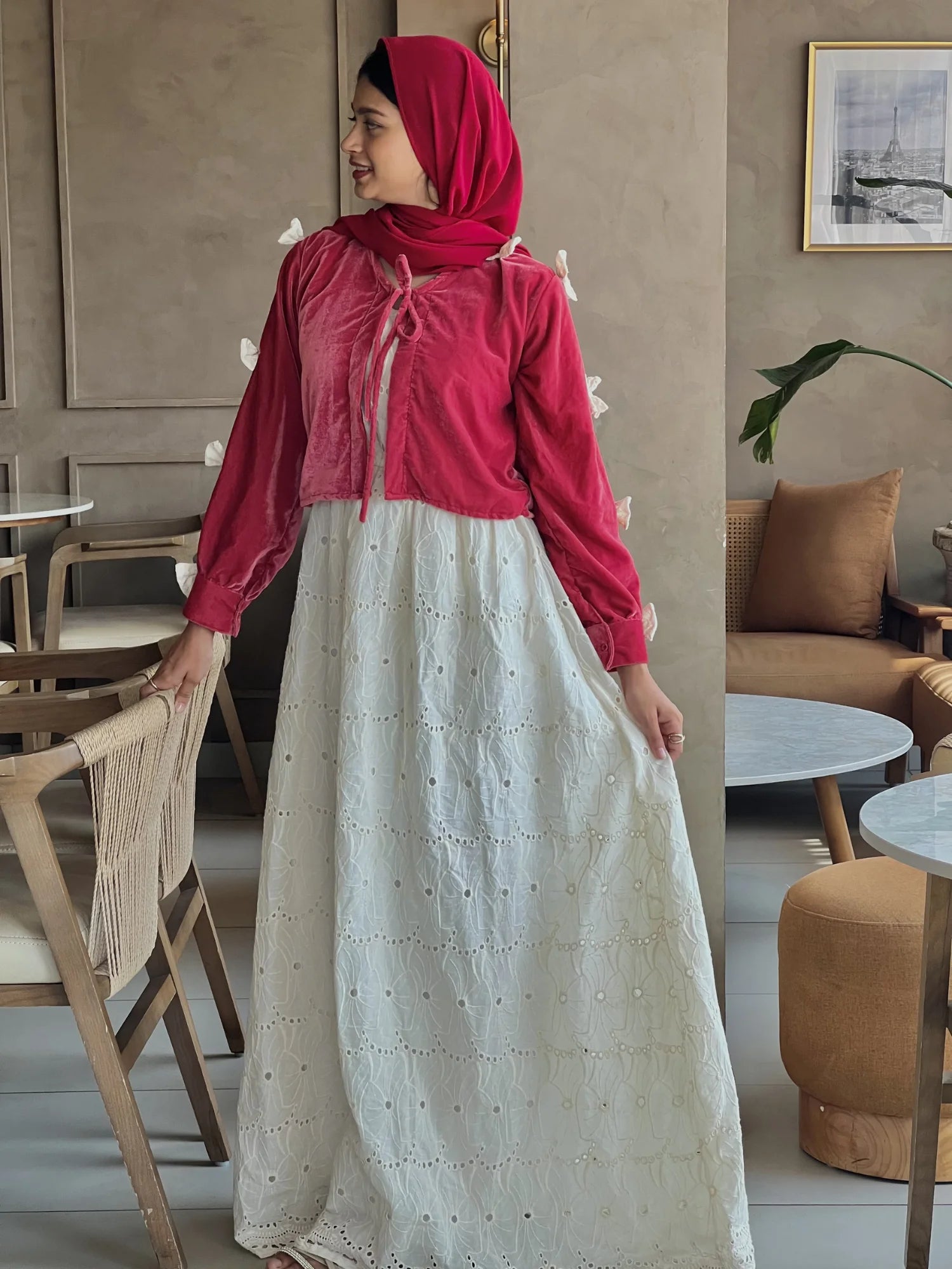 Front view of Pinterest-inspired bow detail maxi dress for women in red and white, featuring bow accents, embroidered layered skirt, modest fit, and hijab styling