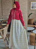 Front view of Pinterest-inspired bow detail maxi dress for women in red and white, featuring bow accents, embroidered layered skirt, modest fit, and hijab styling