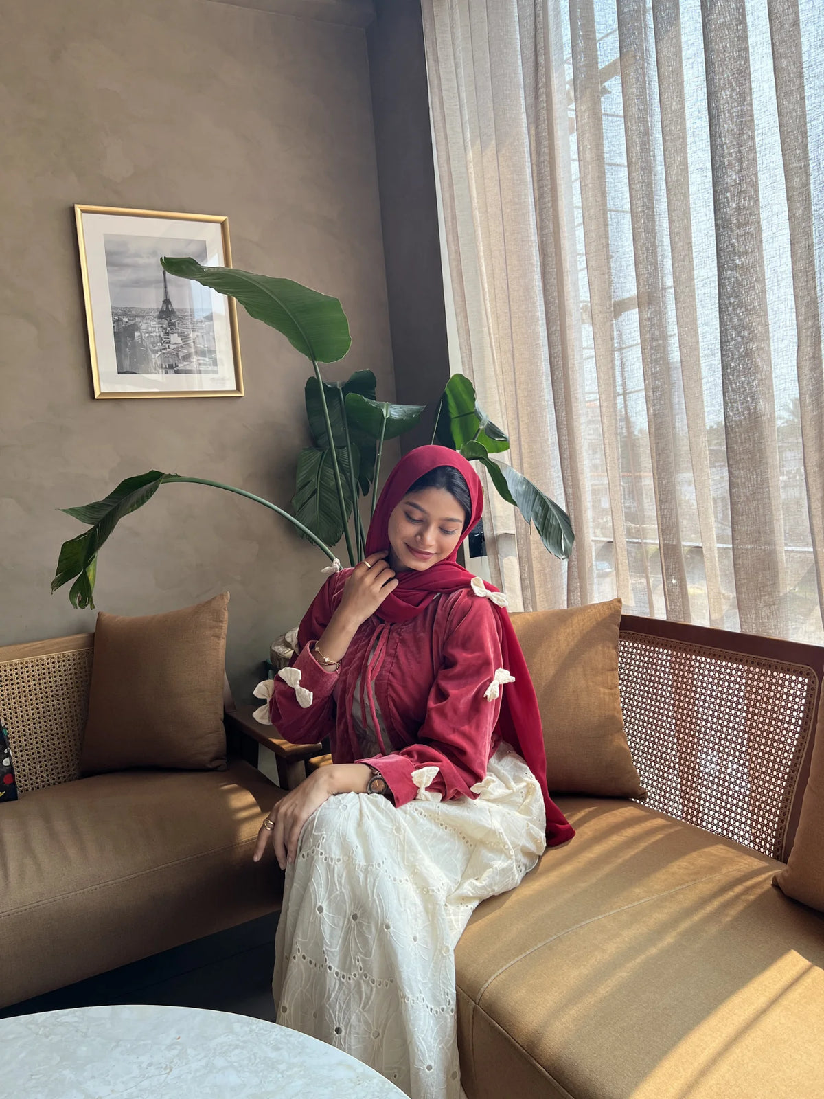 Lifestyle view of Pinterest-inspired bow detail maxi dress for women, featuring layered design, modest fit, soft fabric, and elegant indoor styling with hijab