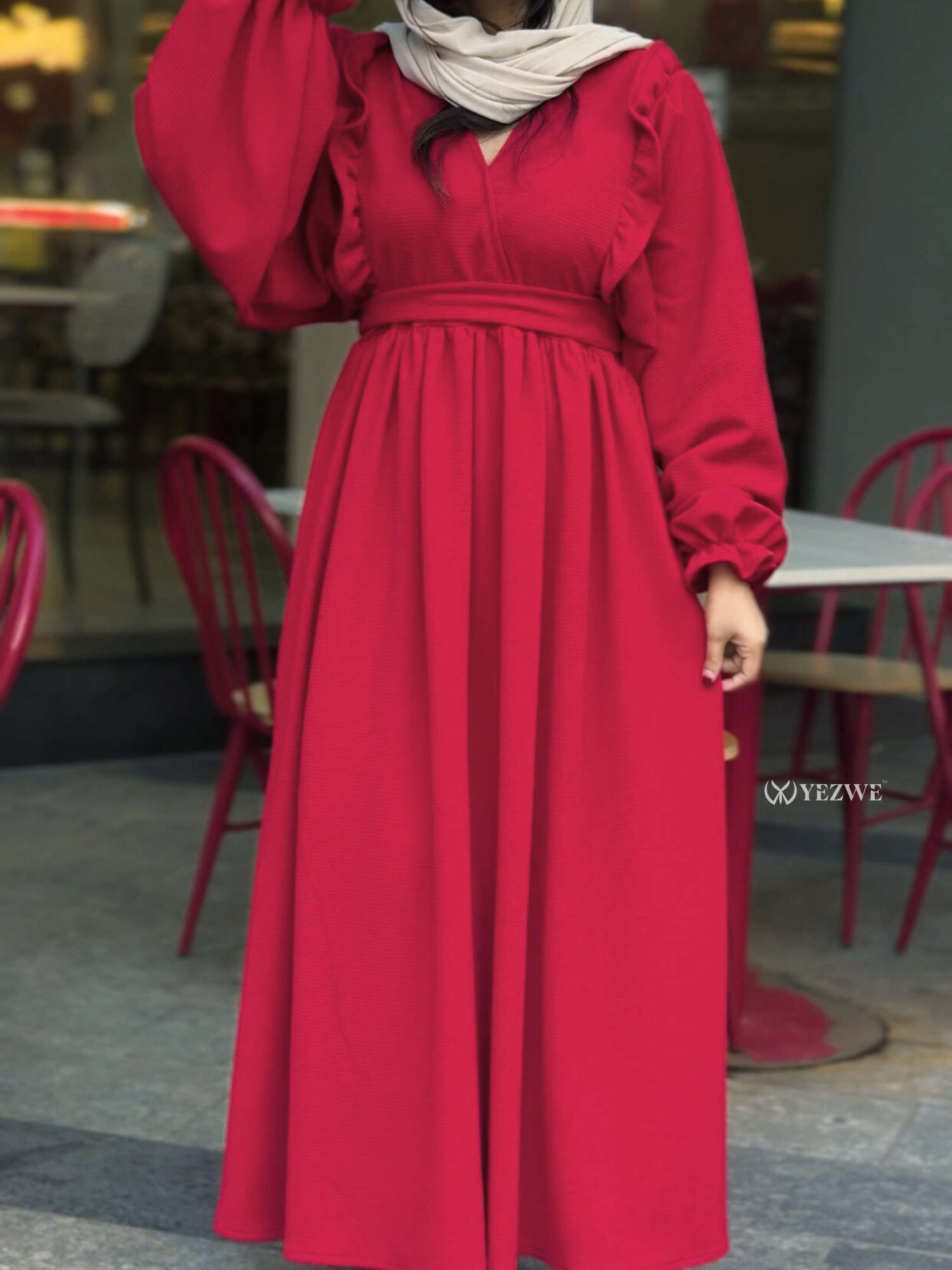 Elegant reddish maroon maxi dress with puff sleeves and a cinched waist for a stylish look