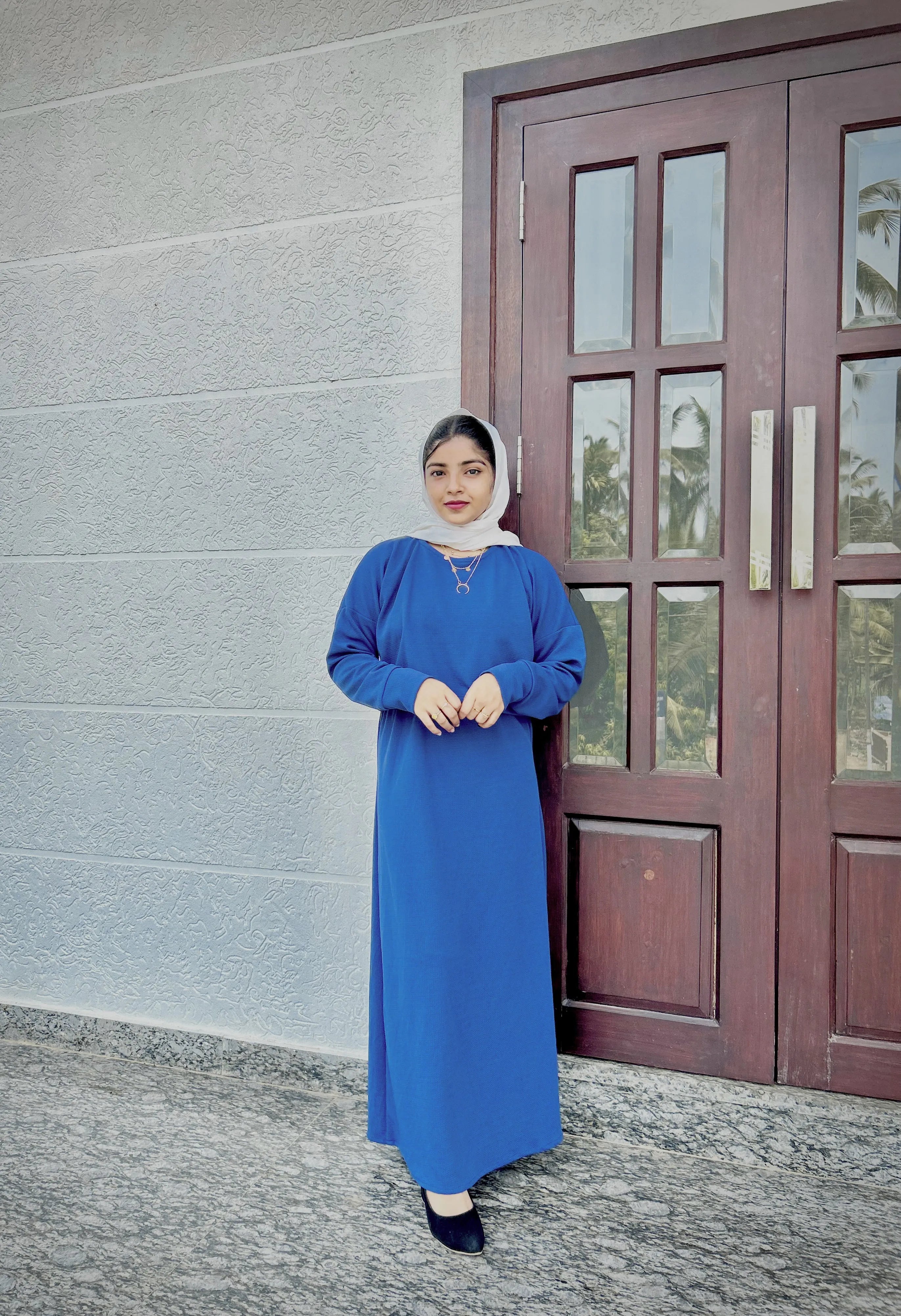 Yezwe Turkish style modest wear featuring a blue top and skirt combination with elegant detailing