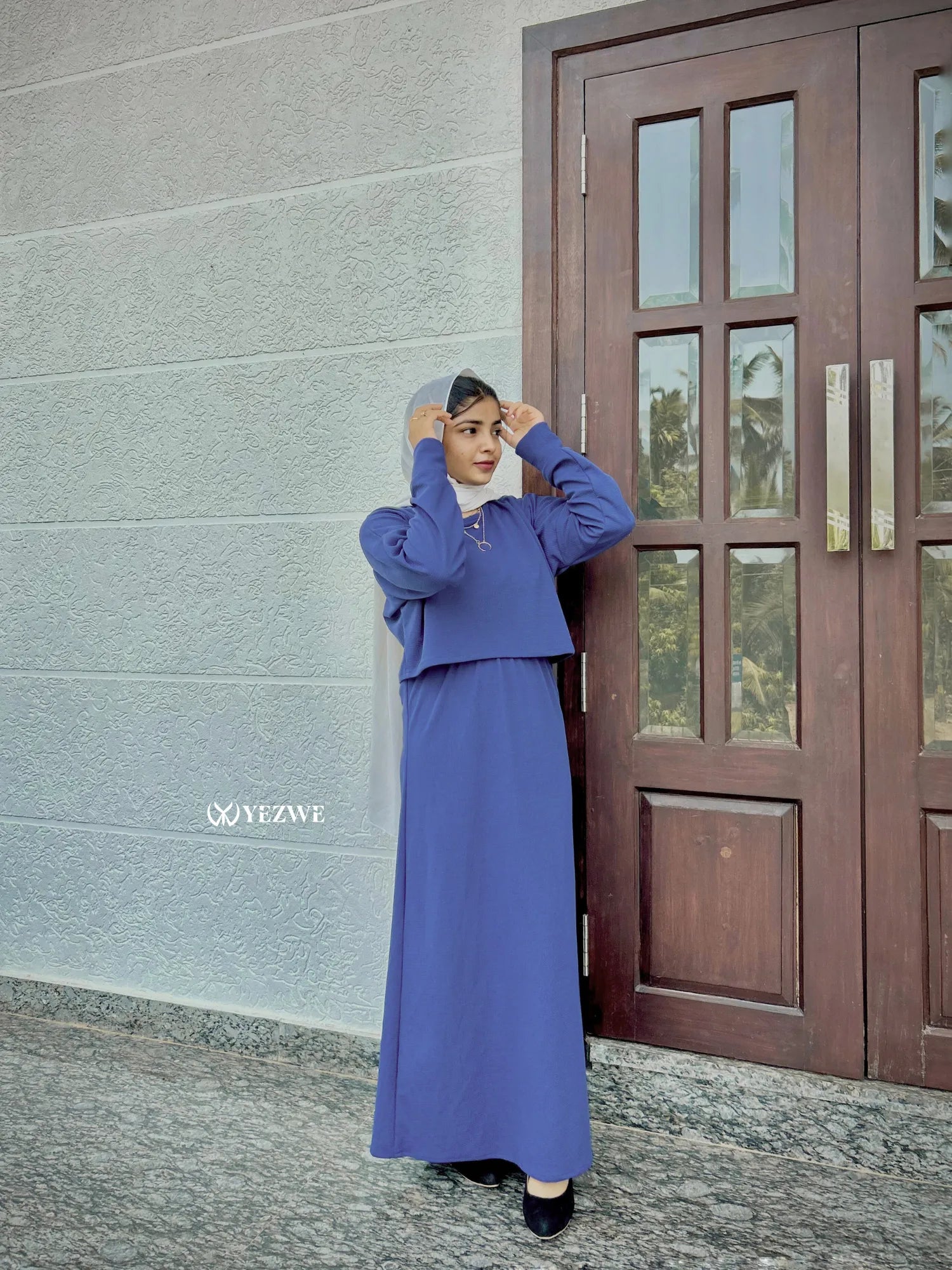 Yezwe Turkish style modest wear featuring a matching top and skirt in a chic blue design