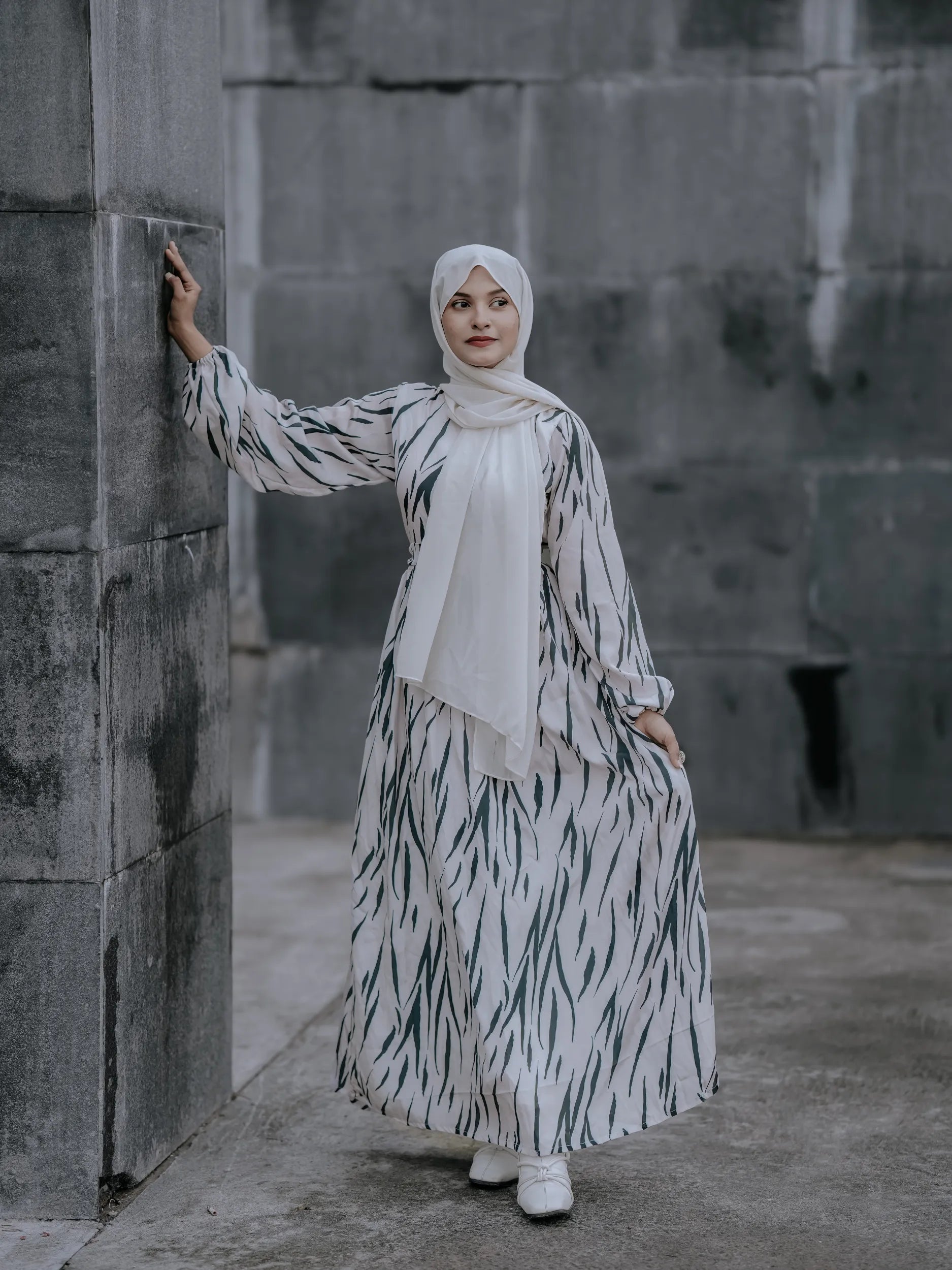 Yezwe v-neck modest dress in a flowing design with abstract patterns, perfect for elegant occasions
