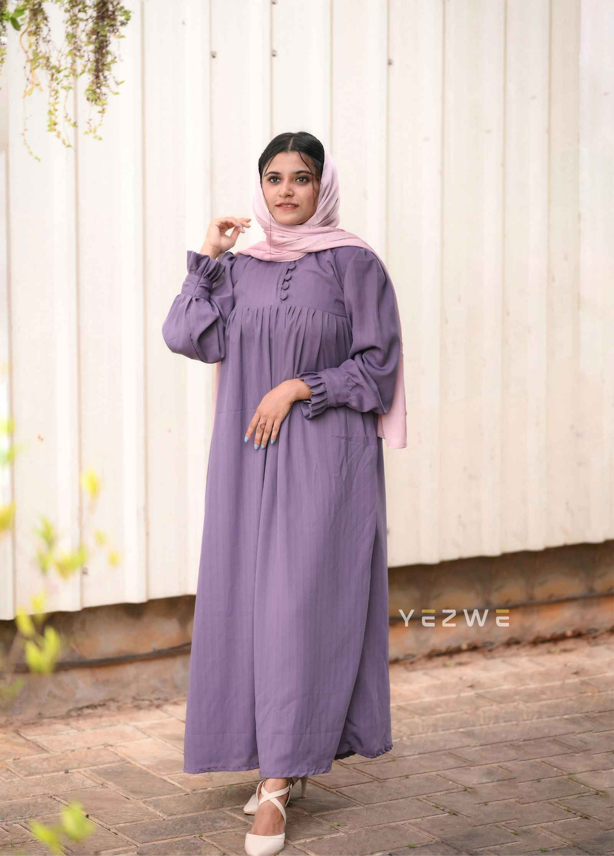 Elegant modest grape purple maxi dress by Yezwe with button details and puff sleeves