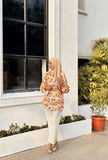 Yezwe yellow print top and white pants outfit styled with a hijab for a chic look