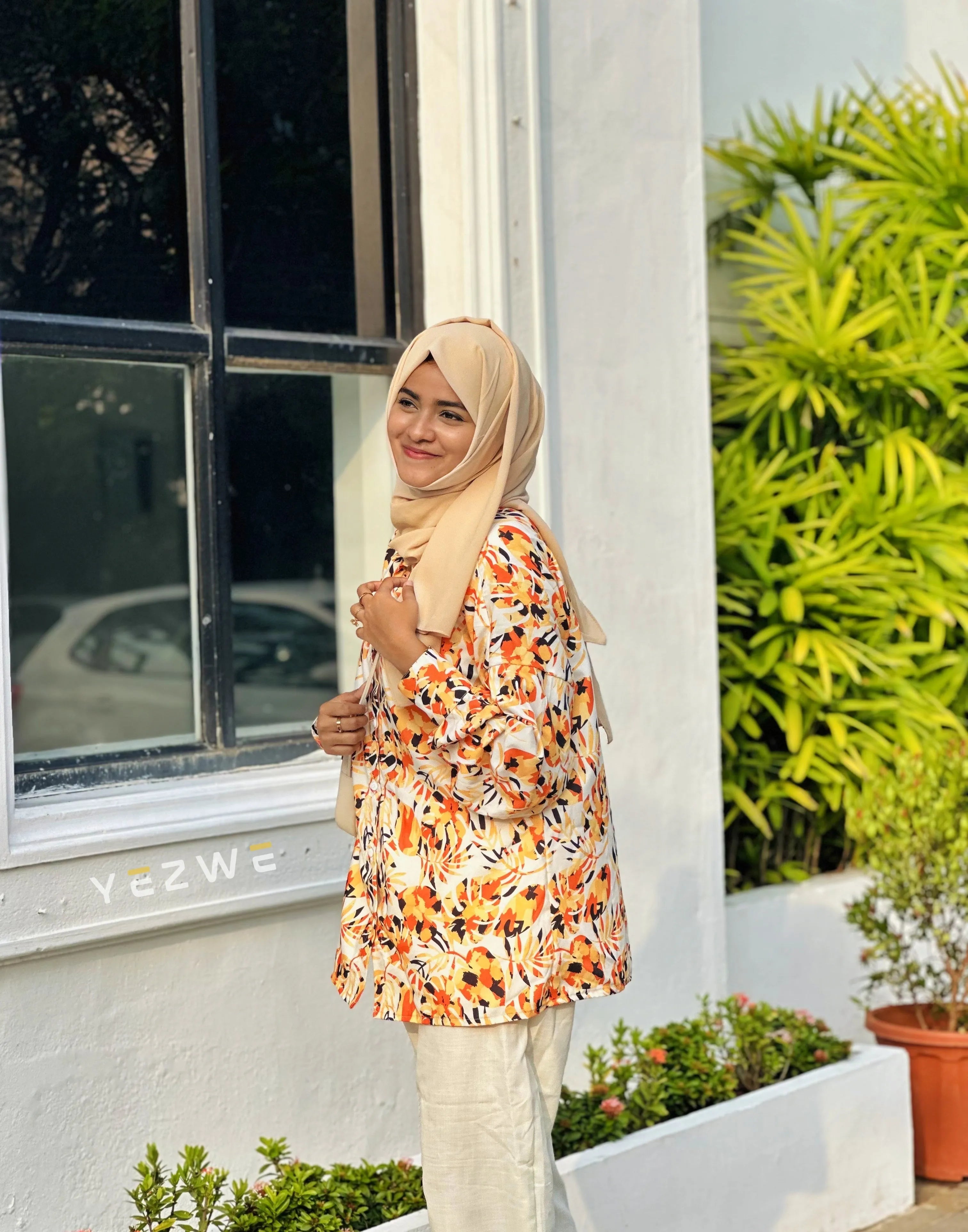 Yezwe yellow print top and white pants outfit perfect for sunny days and casual outings